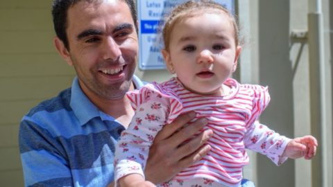 cheerful father and baby