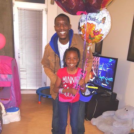 Father and daughter with balloons