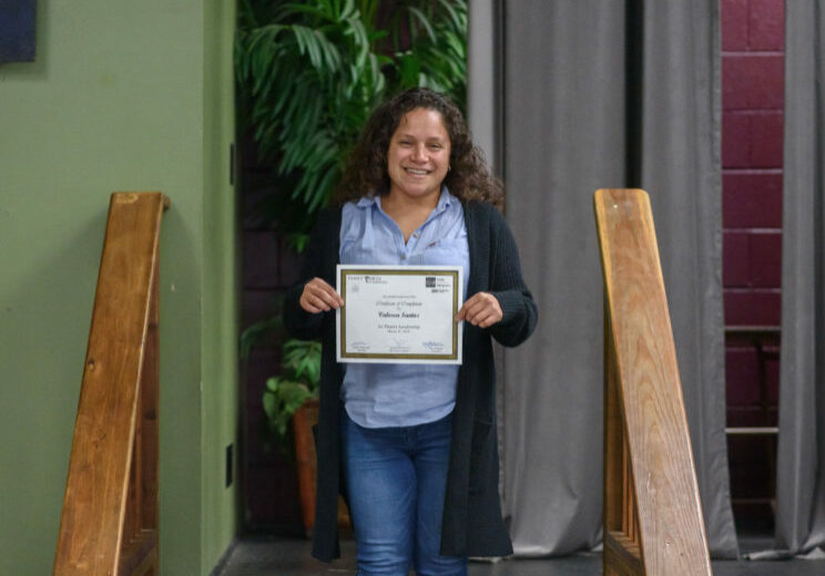 woman with graduation certificate