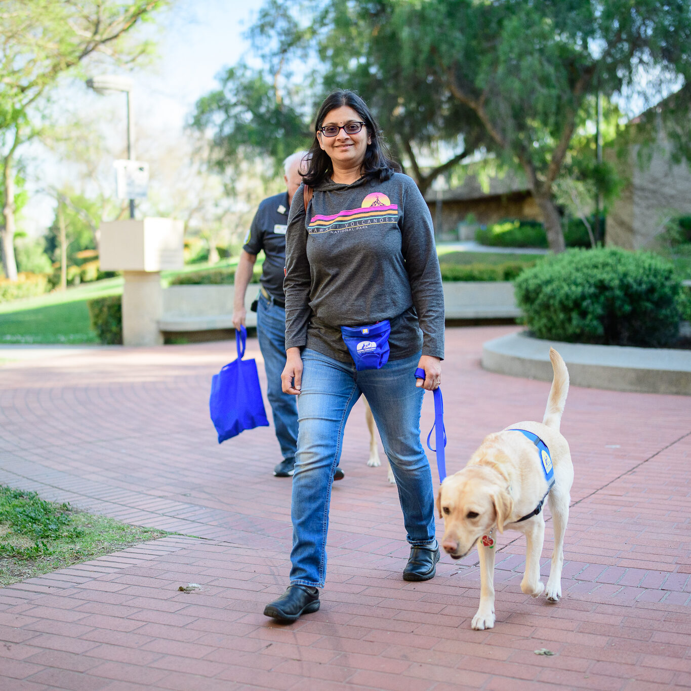woman proudly walks service dog